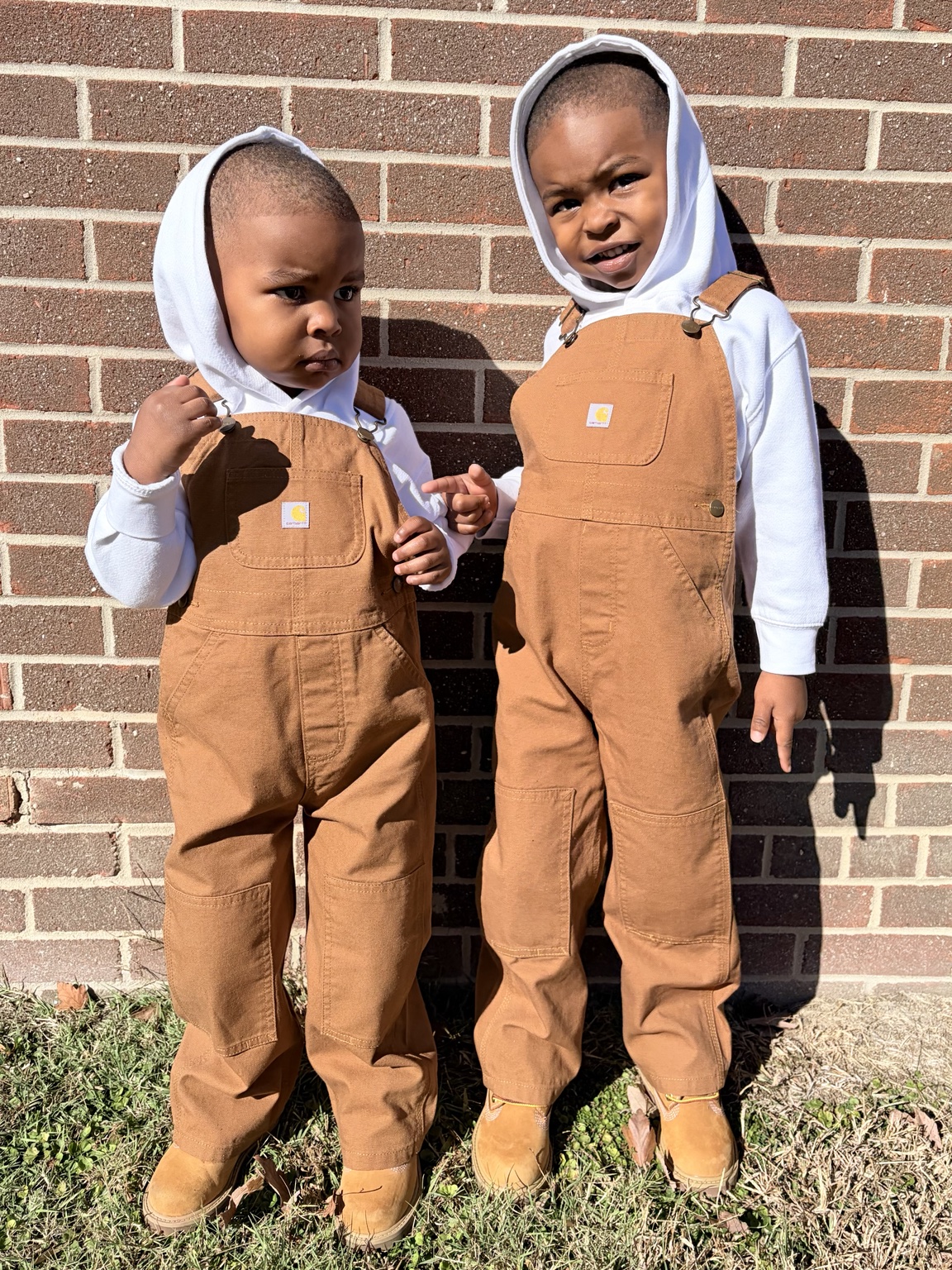Original uploaded photo of Messiah and Mylo in brown overalls